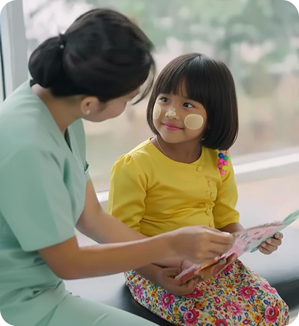 Caregiver reading with young child